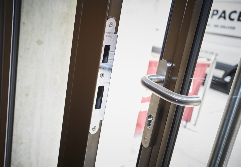IDC Holdings - EC1 London external glazed door standing open with handle