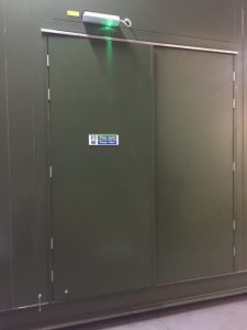 Steel security doors embedded in a wall
