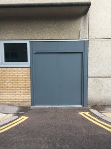 Grey security doors outside a building