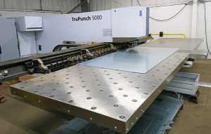 Machine with a piece of metal being cut