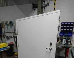 White steel door being produced