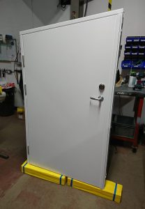 White steel security door in a factory