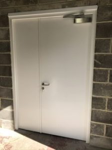 White security door with a white panel