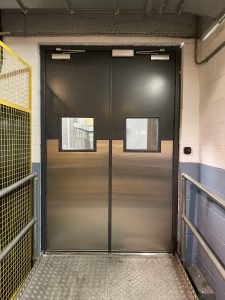 Black and chrome double steel security doors with windows