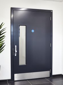 Black security door with a window and a keypad lock