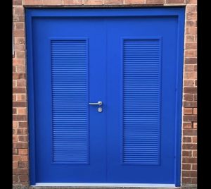 Double blue louvered security door with a sliver handle