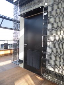 Black external fire rated door with louvre