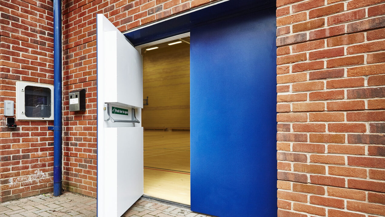 Metador Defender Sportsguard-Steel sports hall fire exit doors featuring rebound panels