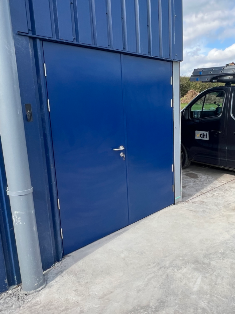 Made by Metador winner October 2025. Defender Safeguard steel double doorset on the exterior of a building with a powder coated finish of RAL 5003